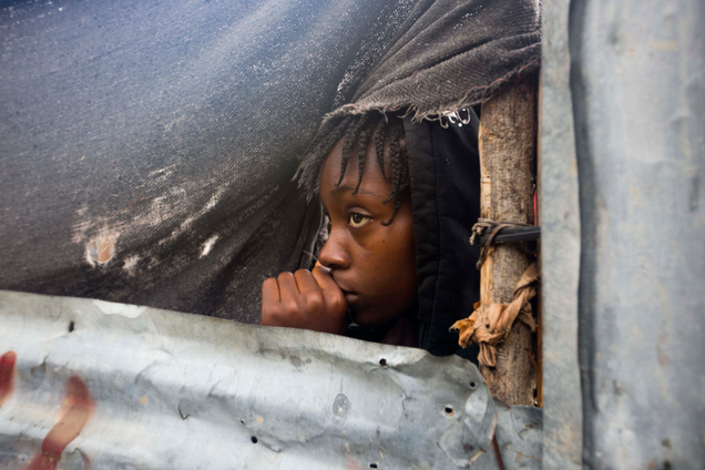 A girl watches as authorities evacuate her house in Tabarre, Haiti, on Oct. 3rd. Image: AP